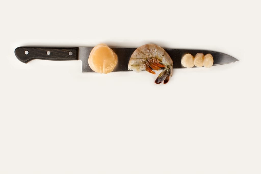 photo of knife with seafood