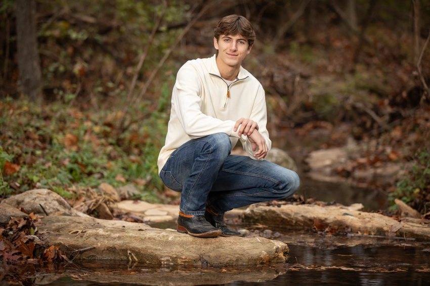 Teen boy in white pullover near Rock Creek