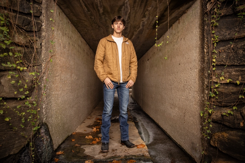 teen in concrete tunnel