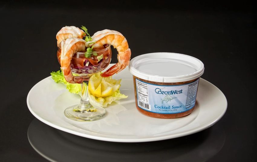 shrimp in glass with package of cocktail sauce