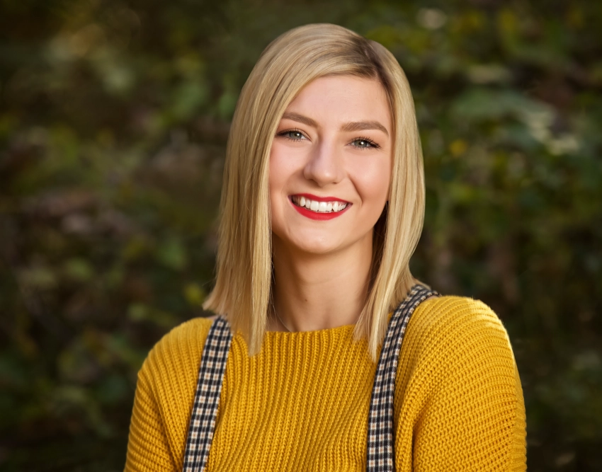 Senior photo teen girl in yellow sweater