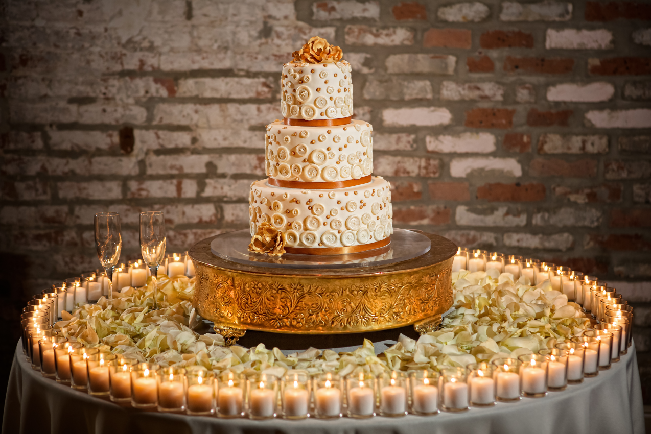 3 tier wedding cake on round table ringed with candles, how to prepare for your wedding