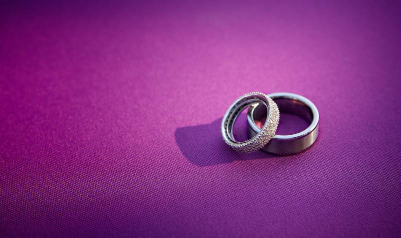 wedding rings on purple